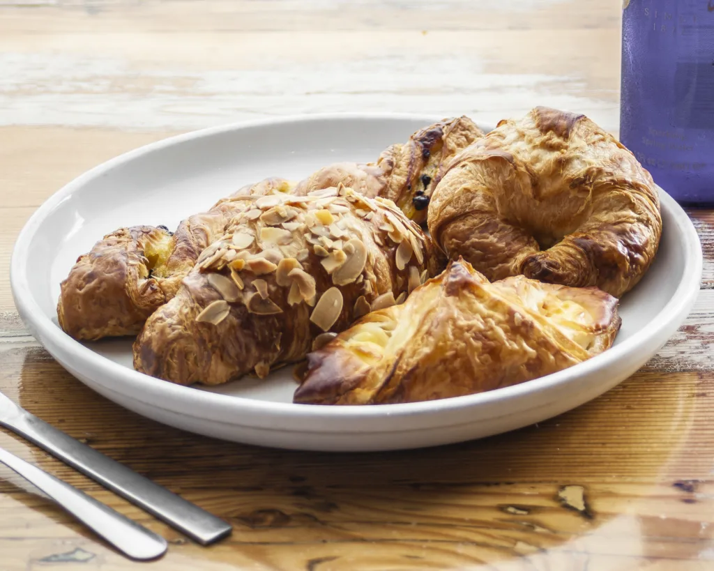 A plate of croissants and pastries