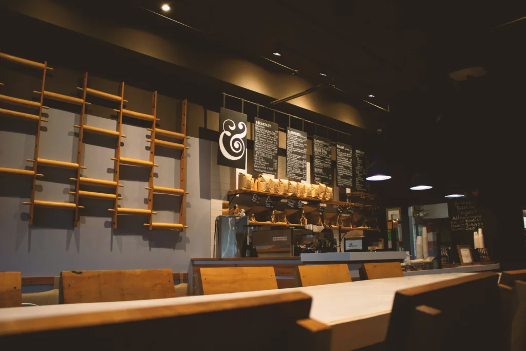 The &grain counter with bread shelves and the menu board