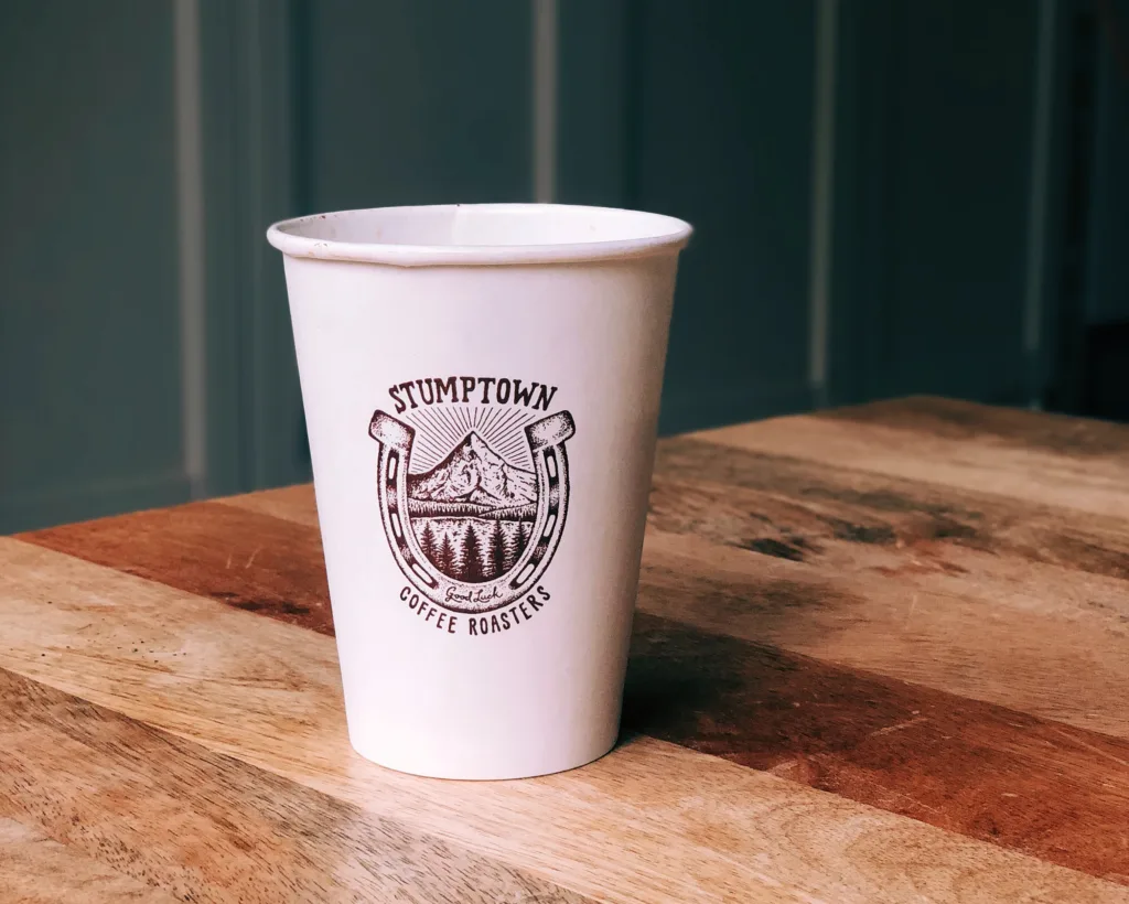 Stumptown Coffee Roasters paper cup on a wooden table