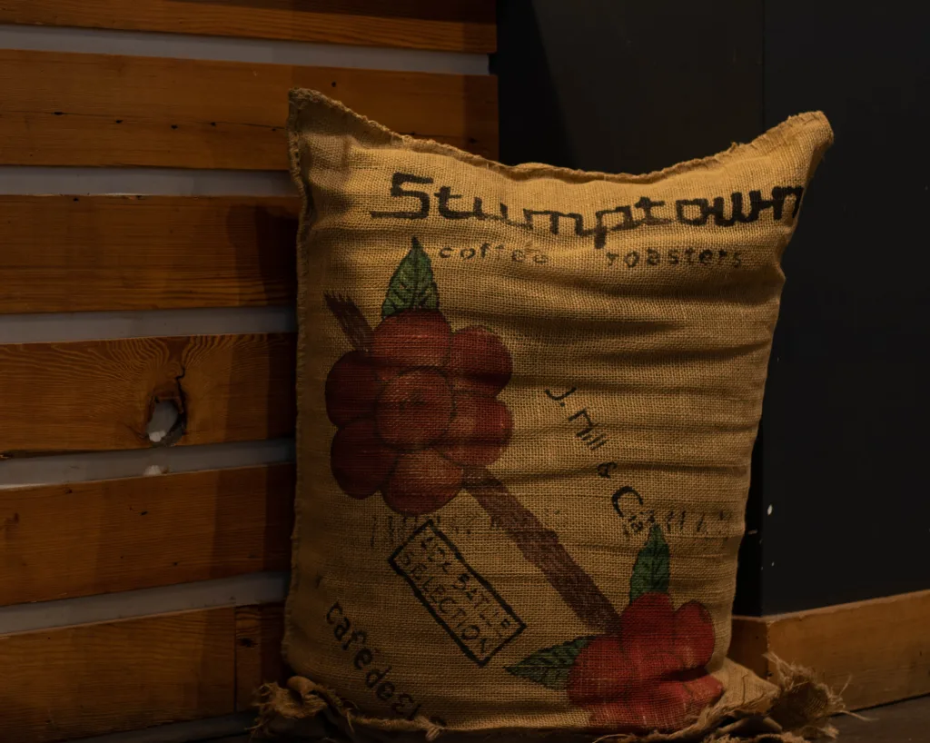 Stumptown Coffee Roasters burlap bean sack against a wooden wall